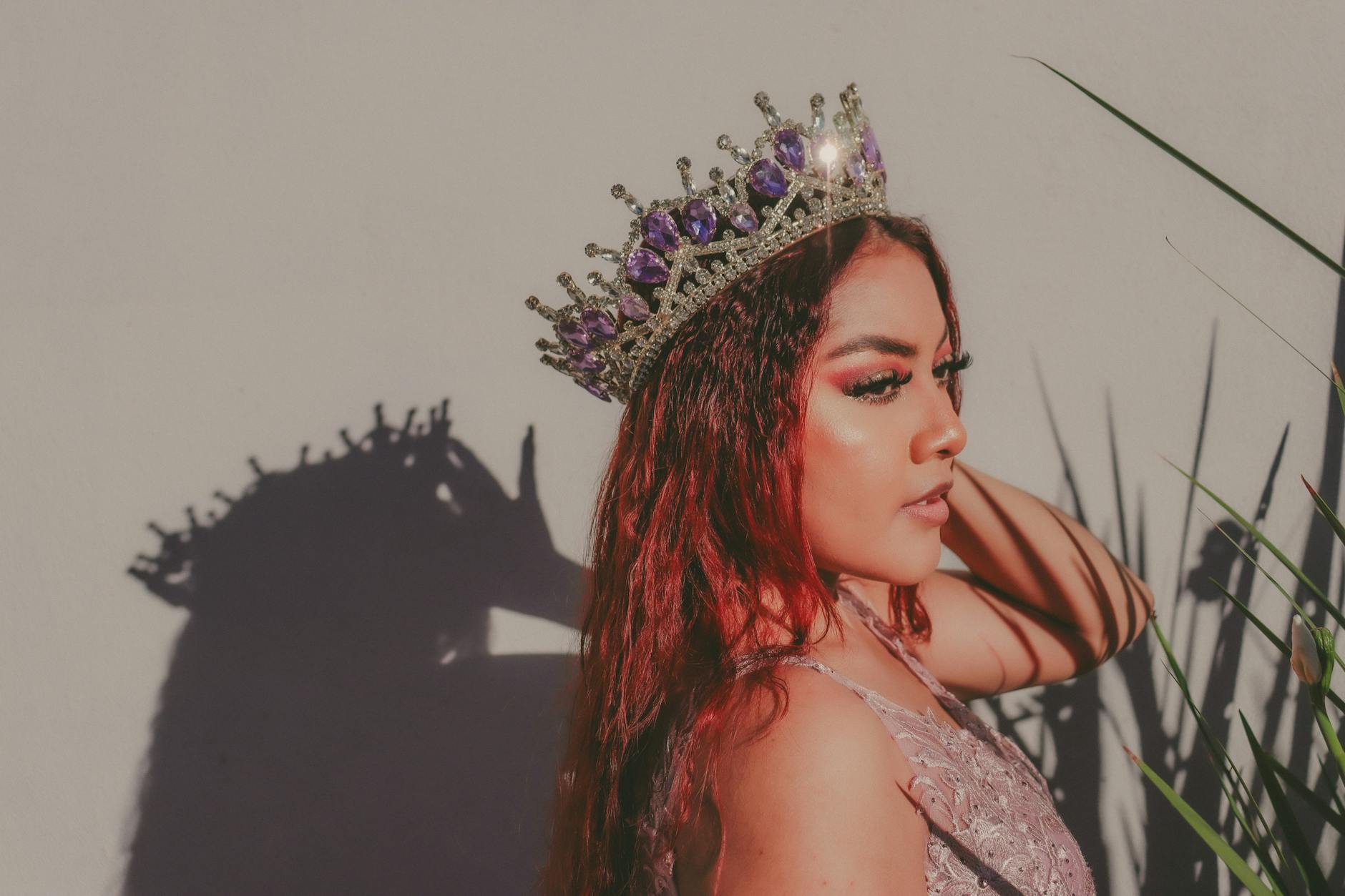 model wearing a crown with purple crystals